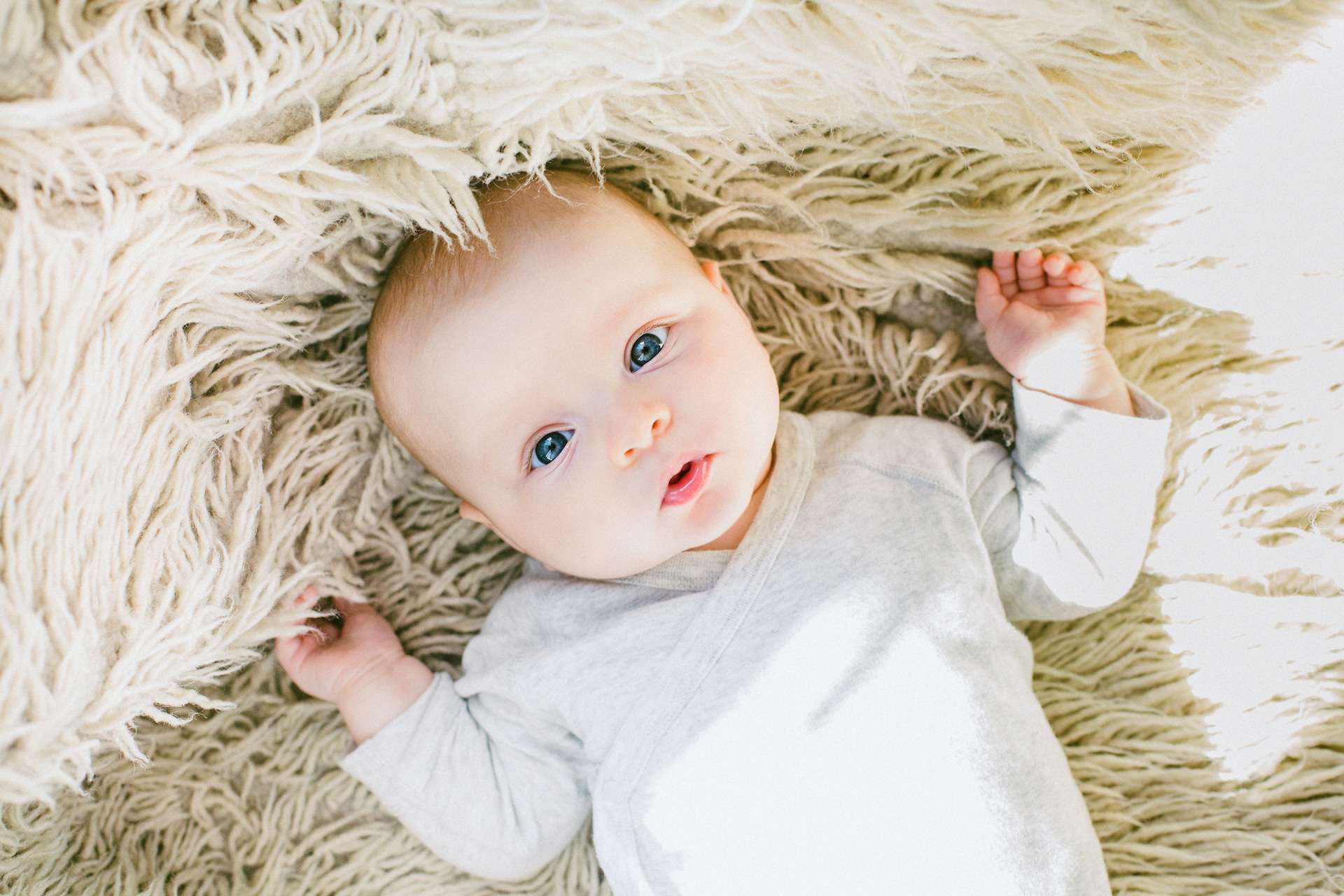 baby lying down on the ground