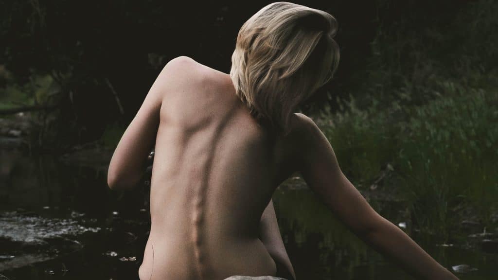 a woman with bare back spine