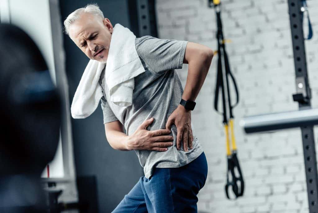 senior sportsman with back pain