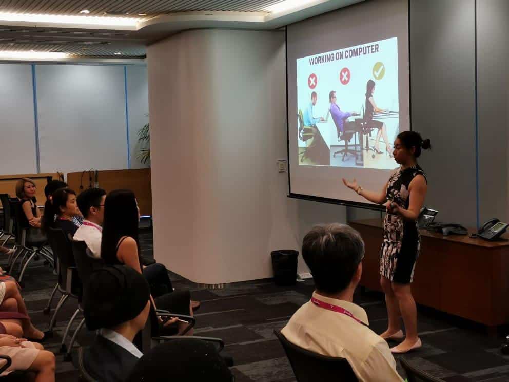 Dr Jenny introducing proper posture on at work