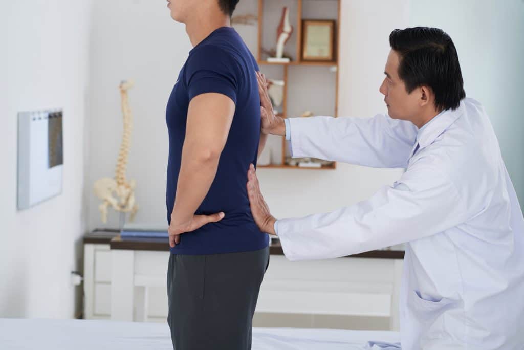 What is Gonstead Technique? A Type of Chiropractic Care 5 chiropractor checking patient