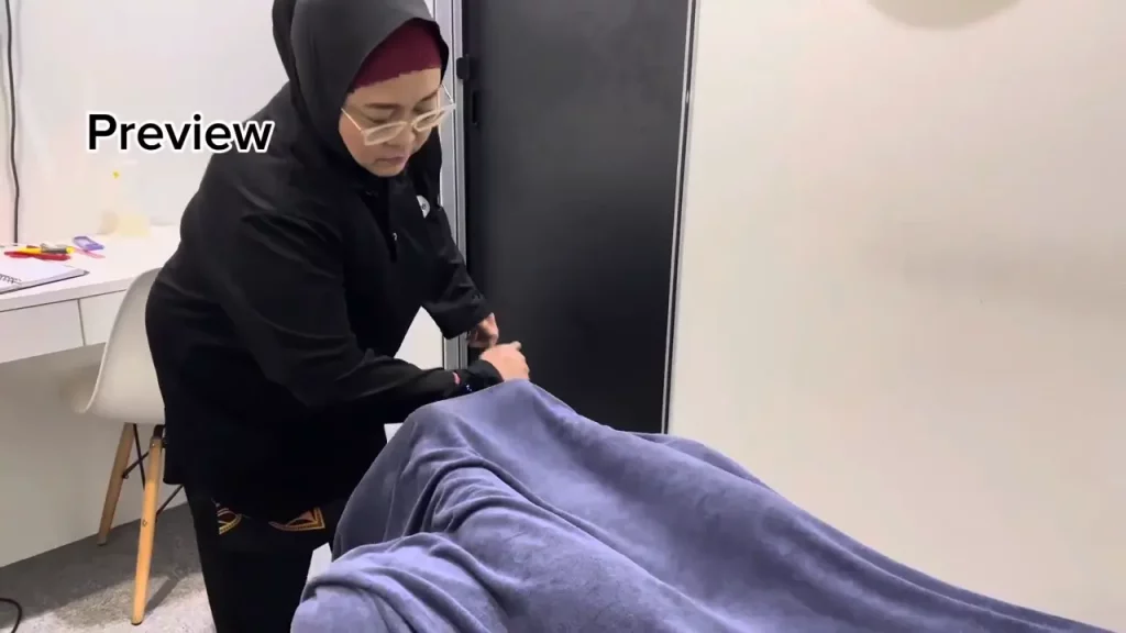 Back and Shoulder Sports Massage Session A sports massage therapist treating back and shoulder stiffness on a patient to improve flexibility and reduce muscle soreness.