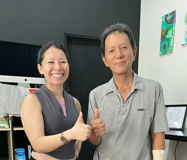 Elderly Man Seeking Chiropractic Back Pain Treatment An old man with our chiropractor Dr Jenny